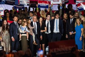 Robert F Kennedy Jr., (4th L), his wife Cheryl Hines (R) and family members during a campaign event to launch his 2024 presidential bid, at the Boston Park Plaza in Boston, Massachusetts, on April 19, 2023.