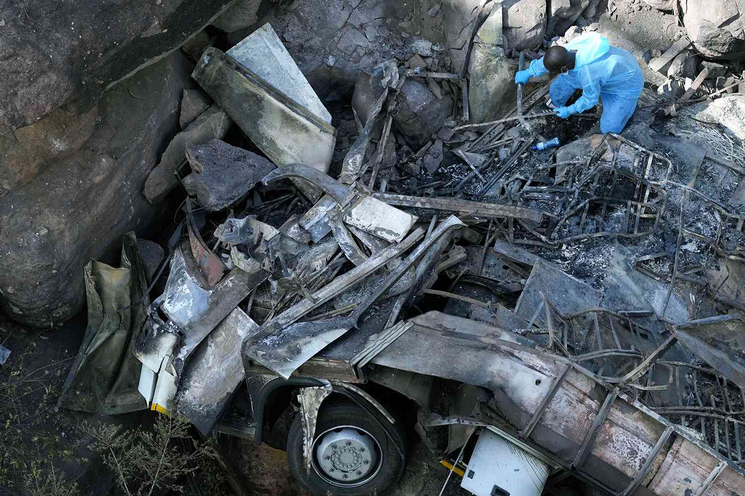 The wreckage off a bus lays in a ravine a day after it plunged off a bridge on the Mmamatlakala mountain pass between Mokopane and Marken, around 300km (190 miles) north of Johannesburg, South Africa, Friday, March 29, 2024. 