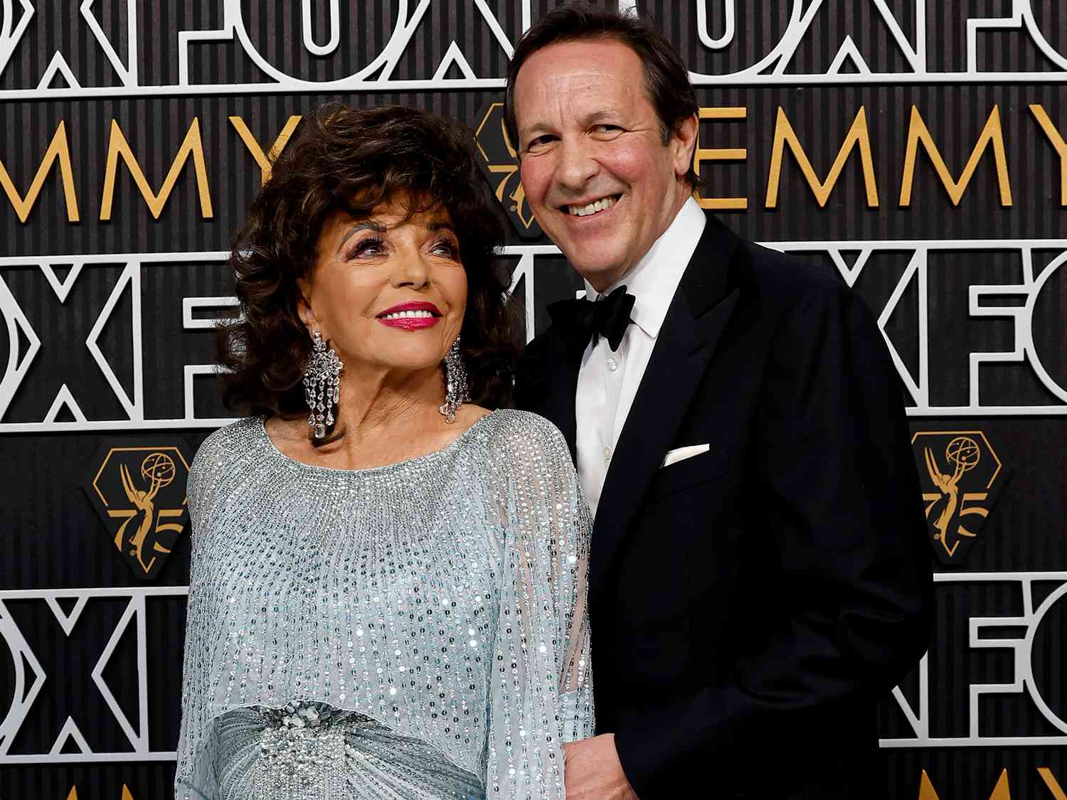 Dame Joan Collins and Percy Gibson attend the 75th Primetime Emmy Awards on January 15, 2024 in Los Angeles, California.