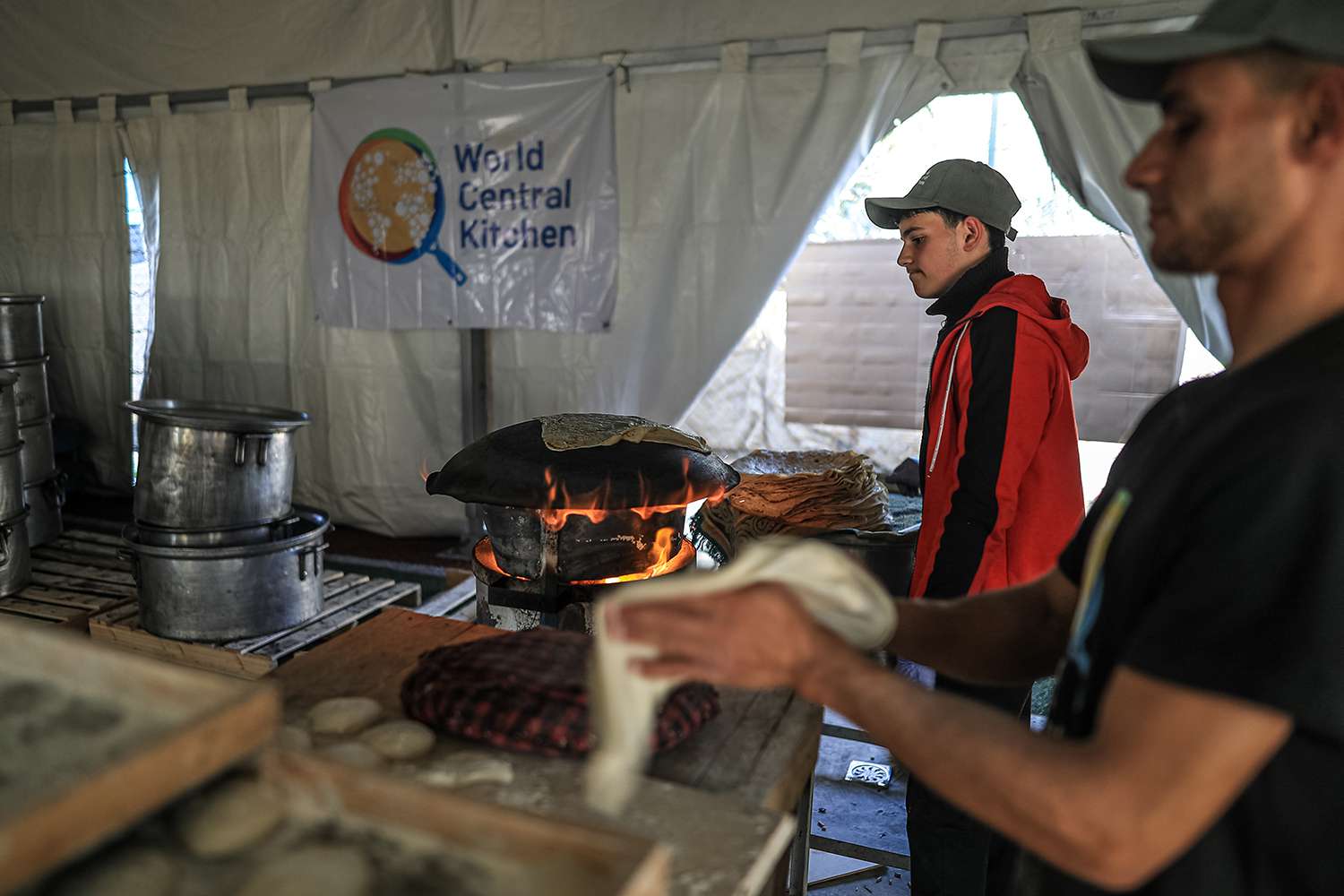 Volunteers of World Central Kitchen cook food for more than 5.000 Palestinians, in the mobile kitchens they have brought to Rafah, Gaza on February 21, 2024. Thousands of Palestinians face the threat of famine due to ongoing Israeli blockade.