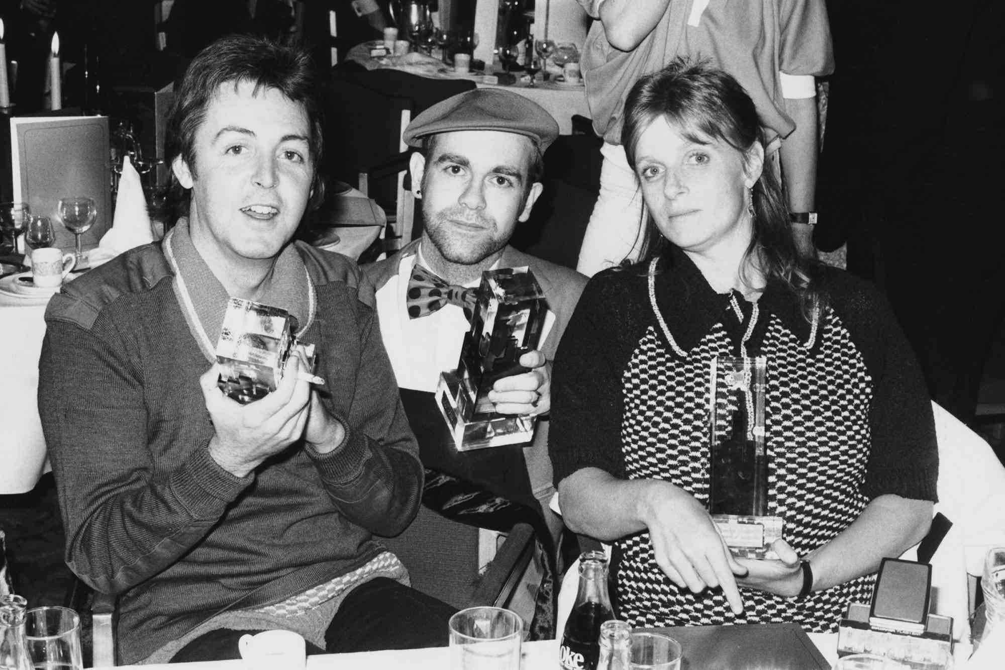Former Beatle Paul McCartney and his wife Linda with Elton John (centre) at the Capital Radio Music Awards at Grosvenor House, London, 22nd March 1978
