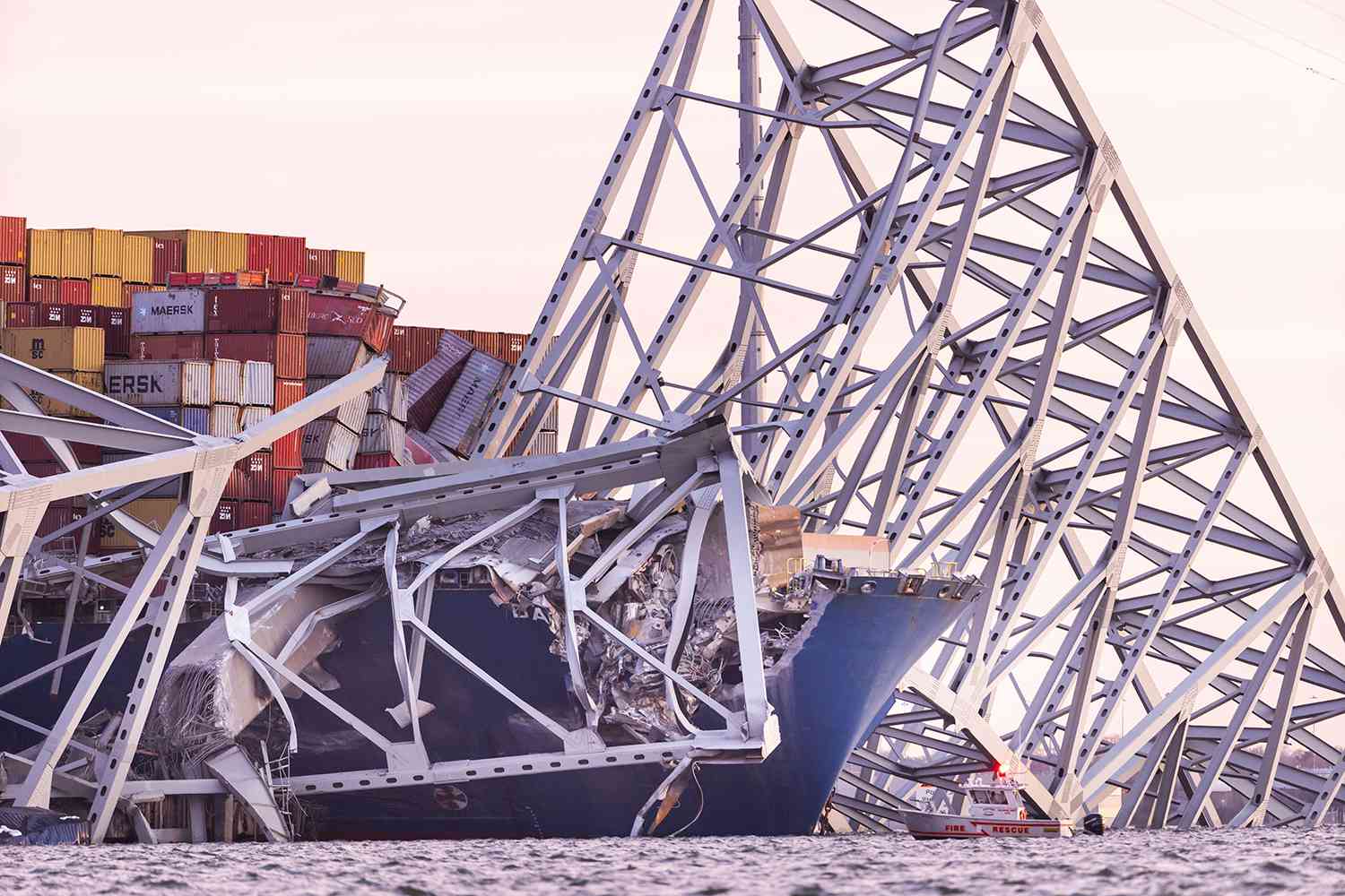 The Francis Scott Key Bridge rests partially collapsed after a cargo ship ran into it in Baltimore, Maryland, on March 26, 2024