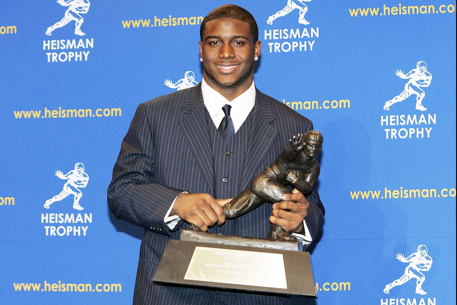 Reggie Bush, University of Southern California tailback holds the Heisman Trophy during the 2005 Heisman Trophy presentation at the Hard Rock Cafe in New York City, New York on December 10, 2005. Bush received 2,541 points in the ballot.