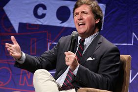 Tucker Carlson speaks onstage during Politicon 2018