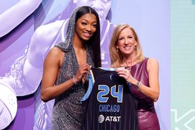 Angel Reese poses with WNBA Commissioner Cathy Engelbert after being selected seventh overall pick by the Chicago Sky during the 2024 WNBA Draft at Brooklyn Academy of Music on April 15, 2024 in New York City.