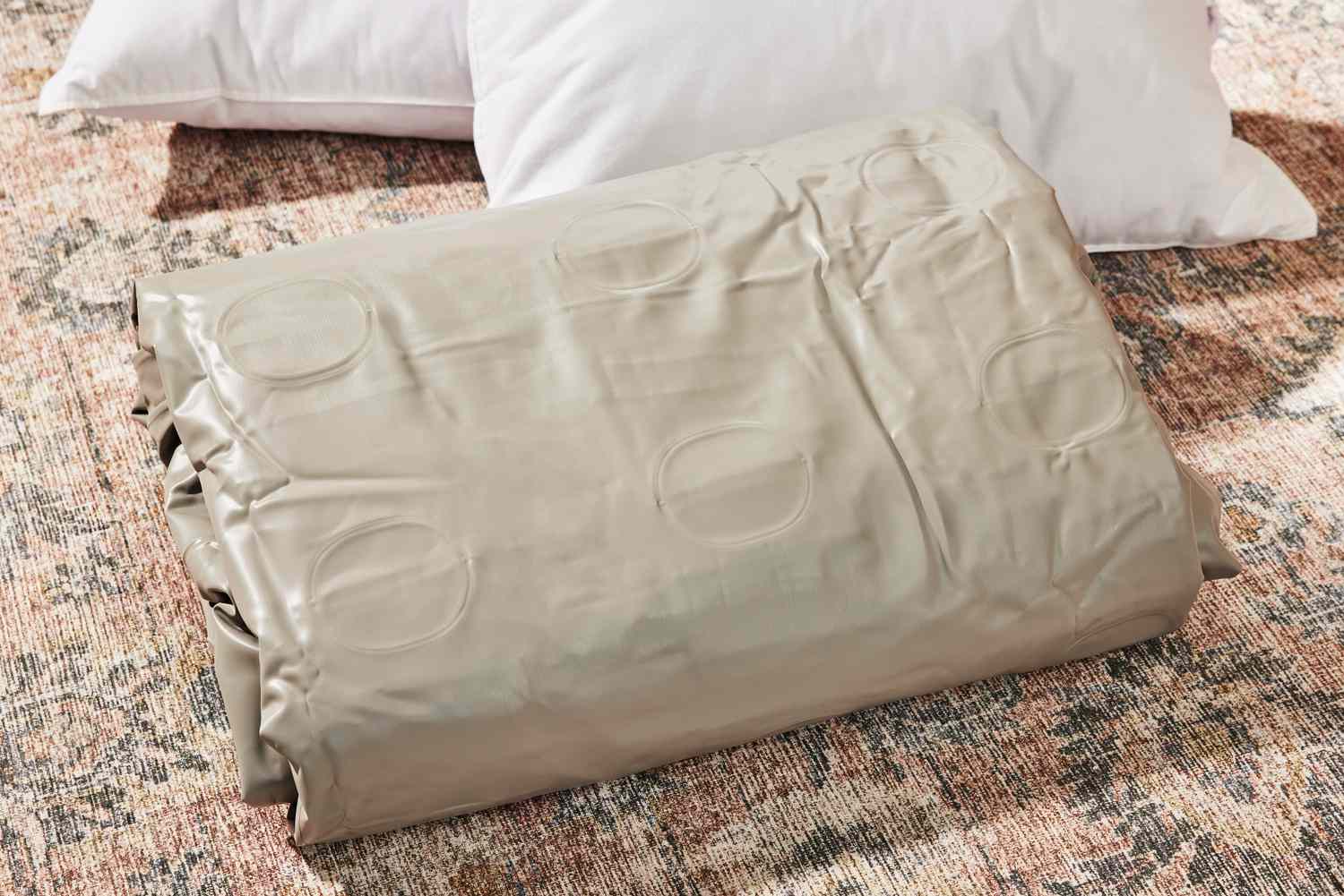 The Insta-Bed Raised 18-in Queen Pillow Top Air Mattress & Internal Never Flat Pump folded 