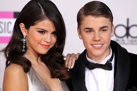 Selena Gomez and Justin Bieber arrive at the 2011 American Music Awards held at Nokia Theatre L.A. LIVE on November 20, 2011 in Los Angeles, California