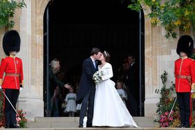Princess Eugenie of York and Jack Brooksbank kiss as they leave after their wedding at St George's Chapel in Windsor Castle on October 12, 2018 in Windsor, England.