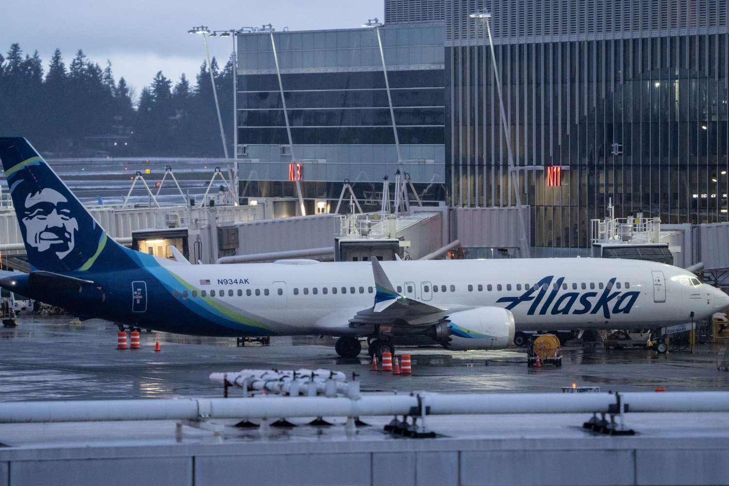 : An Alaska Airlines Boeing 737 MAX 9 plane sits at a gate at Seattle-Tacoma International Airport on January 6, 2024 in Seattle, Washington. Alaska Airlines grounded its 737 MAX 9 planes after part of a fuselage blew off during a flight from Portland Oregon to Ontario, California