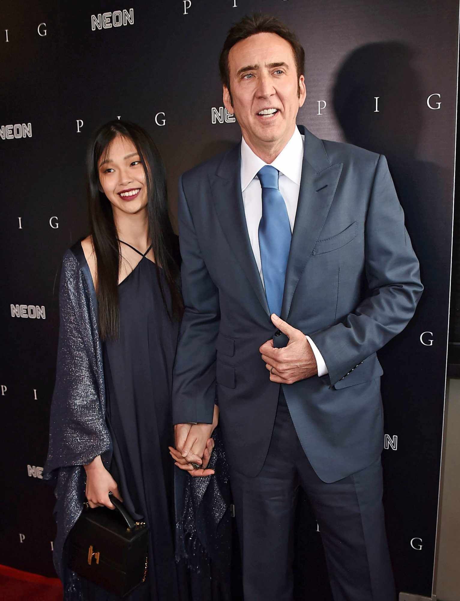 Riko Shibata, left, and Nicolas Cage arrive at the Los Angeles premiere of "Pig", at the Nuart Theatre