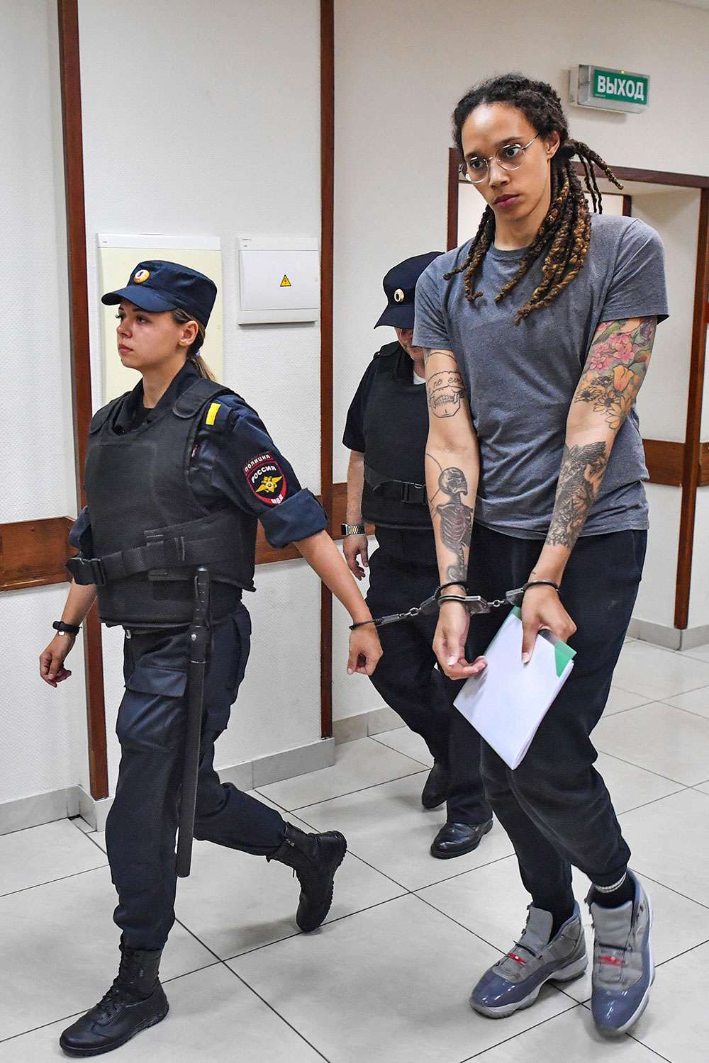 August 4, 2022, Moscow, Russia: US Olympic basketball champion BRITTNEY GRINER (R) is escorted for the verdict announcement at the Khimki Municipal Court in the town of Khimki, northeast of Moscow. Griner has been found guilty of smuggling and possession of drugs and sentenced to nine years in prison. (Credit Image: © Mikhail Voskresensky/TASS via ZUMA Press)