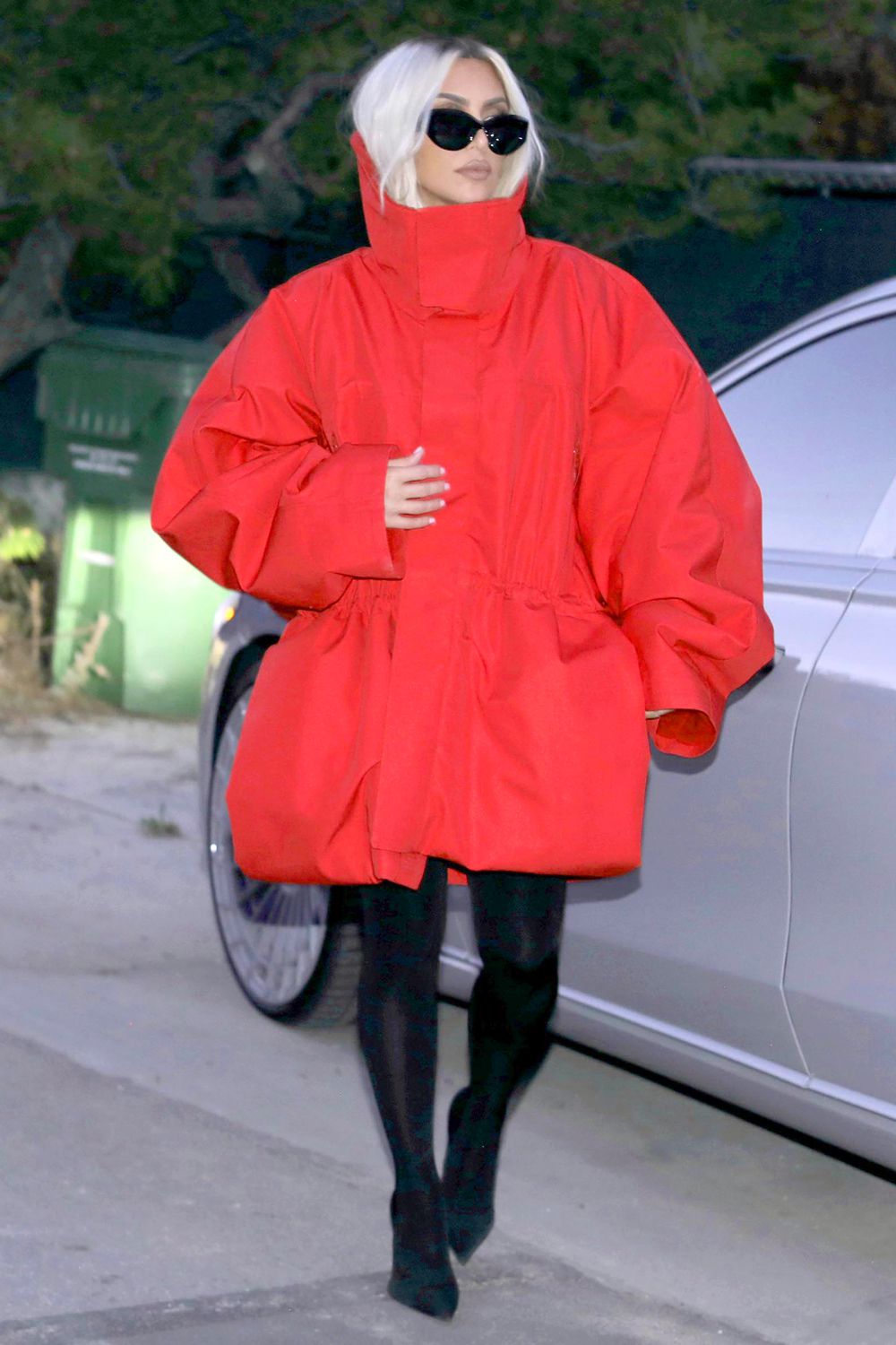 Kim Kardashian steps out at a friend's dinner in red jacket and new blonde hair in Malibu after returning from The White House..
