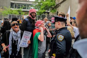 Police face pro-Palestinian demonstrators near the Met Gala at the Metropolitan Museum of Art on May 6, 2024 in New York