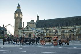 LONDON, ENGLAND - MAY 22: The new Diamond Jubilee state coach arrives from Buckingham Palace during the rehearsal of the State Opening of Parliament on May 22, 2015 in London, England. Rehearsals get on the way for the forthcoming State Opening of Parliament which marks the formal start of the parliamentary year and the Queen's Speech sets out the government's agenda for the coming session. (Photo by Joseph Okpako/Getty Images)