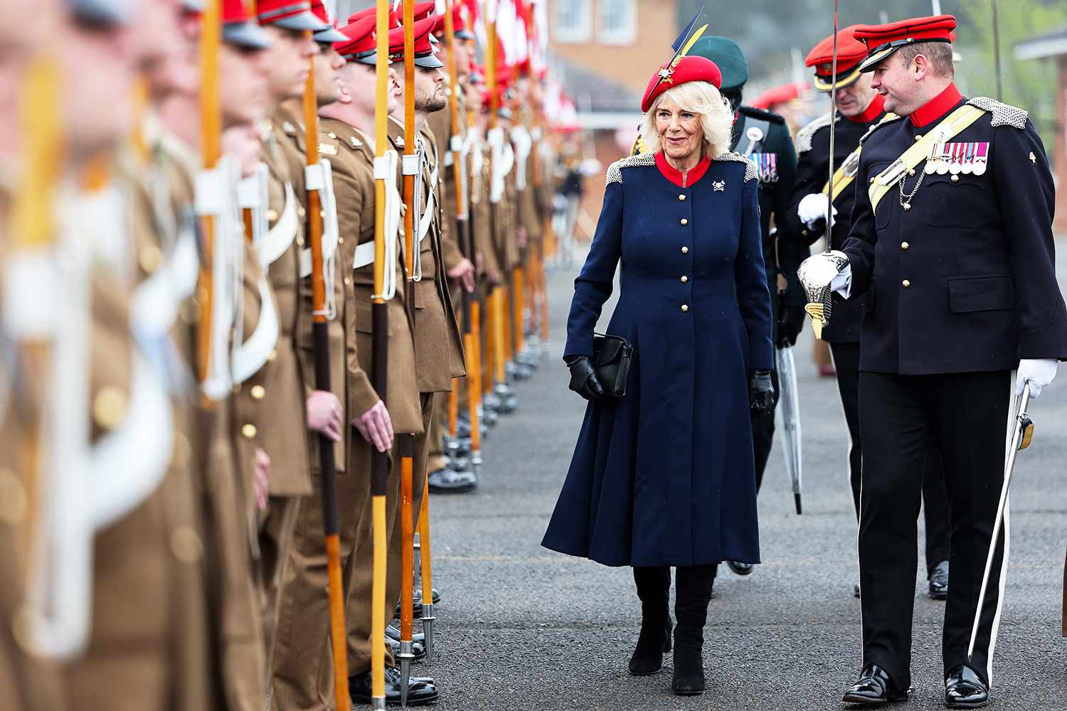 Queen Camilla and Colonel Richard Charrington inspect some of the 152 Lancers on parade during a visit to The Royal Lancers on April 22, 2024 in Catterick, England.