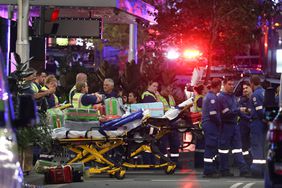 Paramedics are seen with stretchers outside the Westfield Bondi Junction shopping mall after a stabbing incident in Sydney on April 13, 2024. Australian police on April 13 said they had received reports that "multiple people" were stabbed at a busy shopping centre in Sydney. 