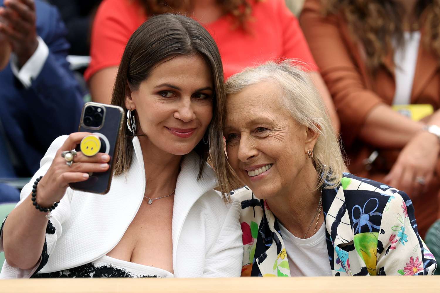Former Women's Singles Champion, Martina Navratilova (R) and her wife Julia Lemigova (L) take a selfie in the Royal Box ahead of the Women's Singles Final between Marketa Vondrousova of Czech Republic and Ons Jabeur of Tunisia on day thirteen of The Championships Wimbledon 2023 