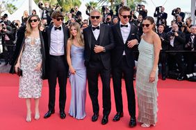 Annie Costner, Hayes Logan Costner, Kevin Costner, Cayden Wyatt Costner, Grace Avery Costner and Lily Costner depart the Horizon: An American Saga Red Carpet at the 77th annual Cannes Film Festival at Palais des Festivals on May 19, 2024 in Cannes, France.
