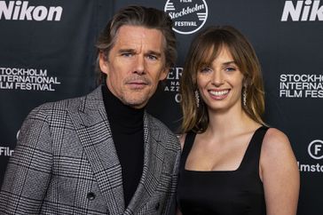 Ethan Hawke and Maya Hawke pose on the red carpet during a ceremony for the Stockholm Film Festival's Lifetime Achievement Award 2023
