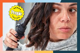 Person curling their hair with the NuMe Automatic Curling Wand