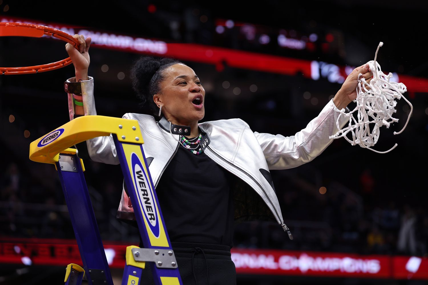 Head coach Dawn Staley of the South Carolina Gamecocks cuts down the net after beating the Iowa Hawkeyes in the 2024 NCAA Women's Basketball Tournament National Championship at Rocket Mortgage FieldHouse on April 07, 2024 in Cleveland, Ohio. South Carolina beat Iowa 87-75. 