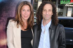 Musician Kenny G. and his wife arrive at the Los Angeles Premiere "Splice" at Grauman's Chinese Theatre on June 2, 2010 in Hollywood, California. (Photo by Barry King/FilmMagic)