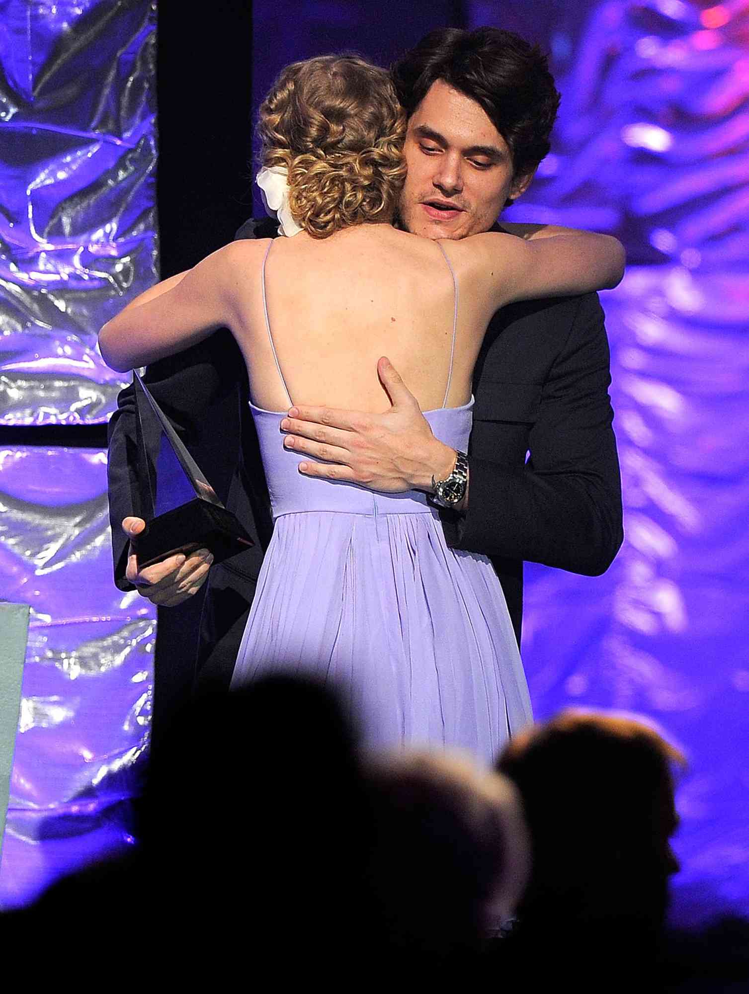 John Mayer and Taylor Swift perform onstage during the 41st Annual Songwriters Hall of Fame Ceremony at The New York Marriott Marquis on June 17, 2010 in New York City