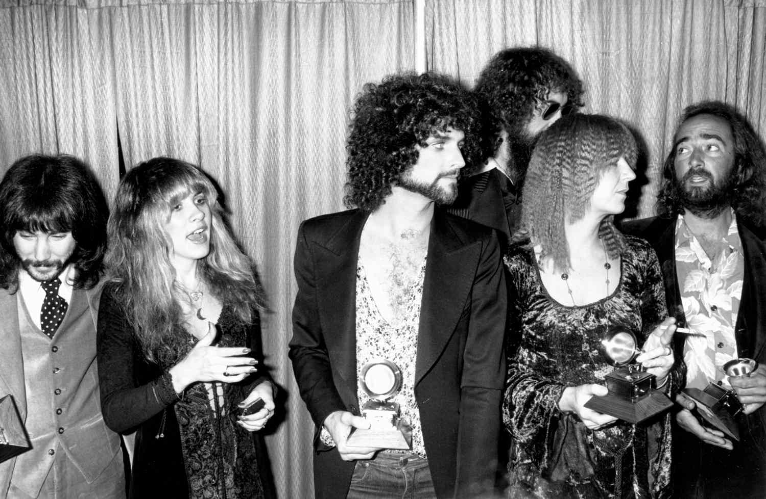 Rock group Fleetwood Mac wins the Album of the year award at the 20th Grammy awards at the Shrine Auditorium. Left to right producer Richard Dashut, Stevie Nicks, Lindsey Buckingham, Mick Fleetwood, Christine McVie and John McVie on February 23, 1978 in Los Angeles, California.
