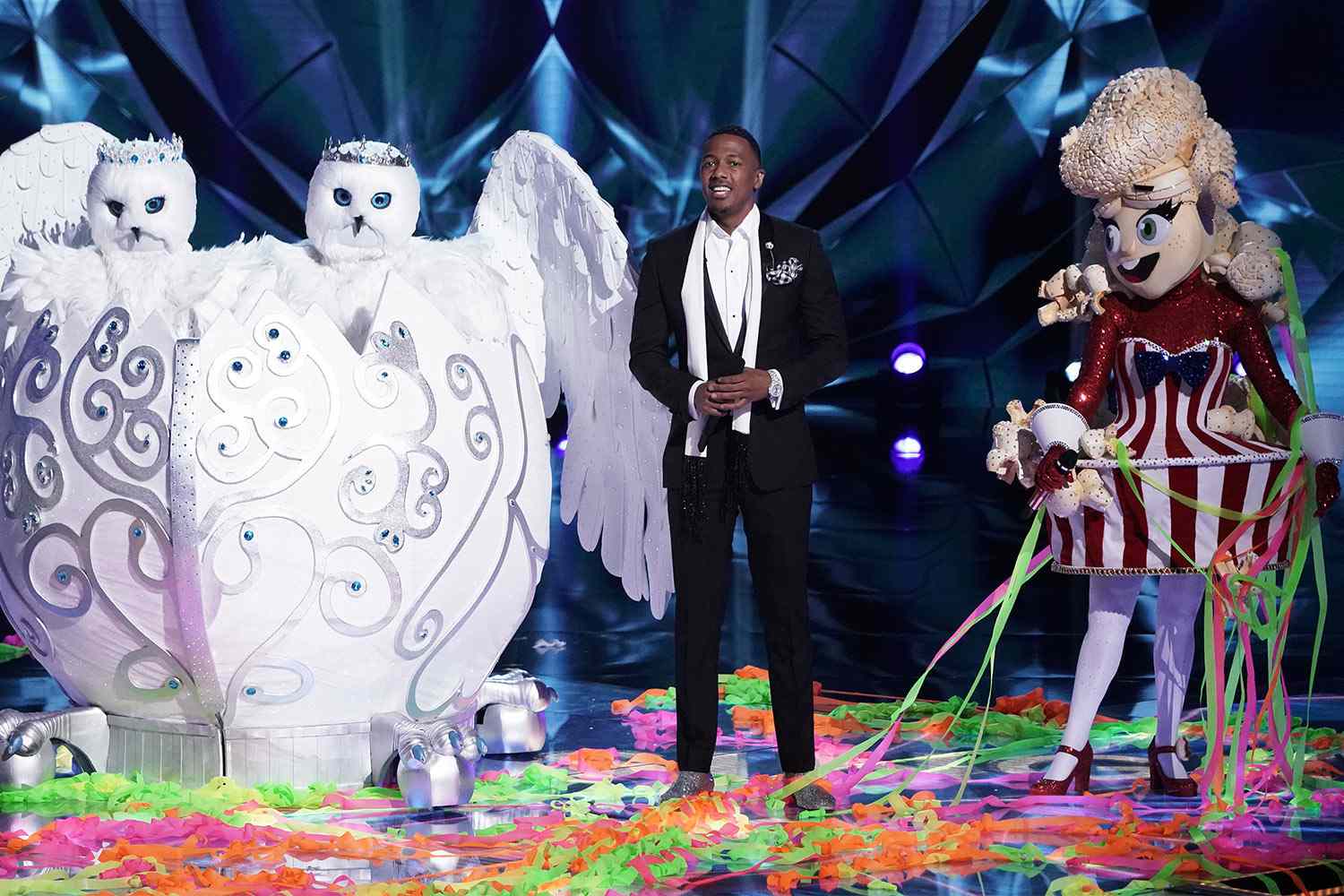 Snow Owls and Popcorn on stage with host Nick Cannon.