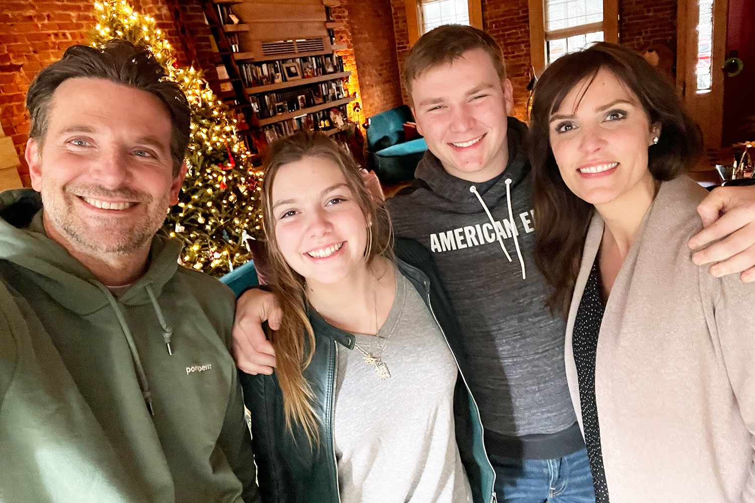 Taya Kyle and her children Colton and McKenna visit with Bradley Cooper and watch American Sniper for the first time. December 2023 in New York at Bradley's home.