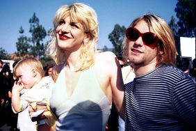Kurt Cobain, Courtney Love and baby Frances Bean attending the 1993 MTV Music Video Awards