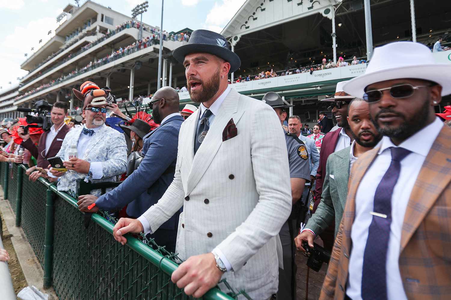 Kansa City Chiefs player Travis Kelce enjoys a race at the 150th running of the Kentucky Derby at Churchill Downs 