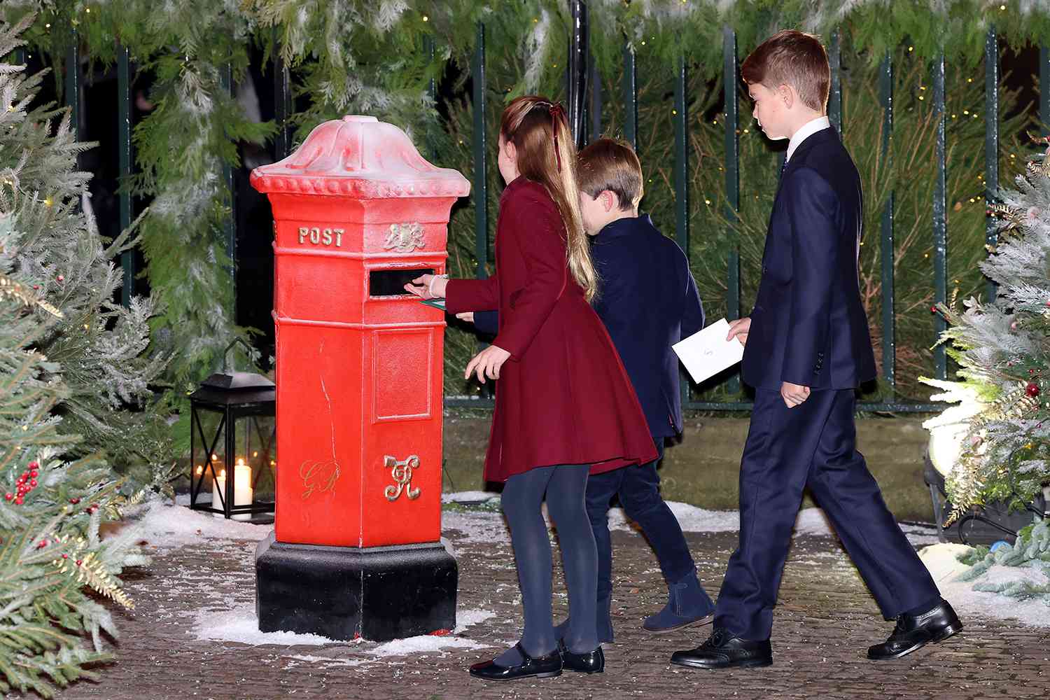 Princess Charlotte of Wales, Prince Louis of Wales and Prince George of Wales post letters to Santa before The "Together At Christmas" Carol Service at Westminster Abbey on December 08, 2023 in London, England.