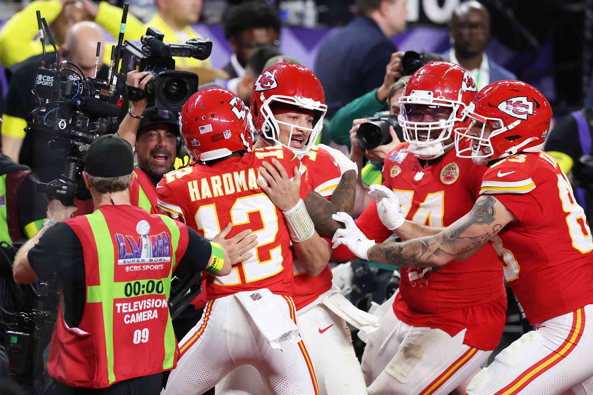 Mecole Hardman Jr. #12 of the Kansas City Chiefs celebrates with Patrick Mahomes #15 after scoring the game-winning touchdown in overtime to defeat the San Francisco 49ers 25-22 during Super Bowl LVIII at Allegiant Stadium on February 11, 2024 in Las Vegas, Nevada. 