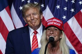 US Representative Marjorie Taylor Greene (R) speaks alongside former US President and 2024 presidential hopeful Donald Trump at a campaign event in Rome, Georgia, on March 9, 2024.
