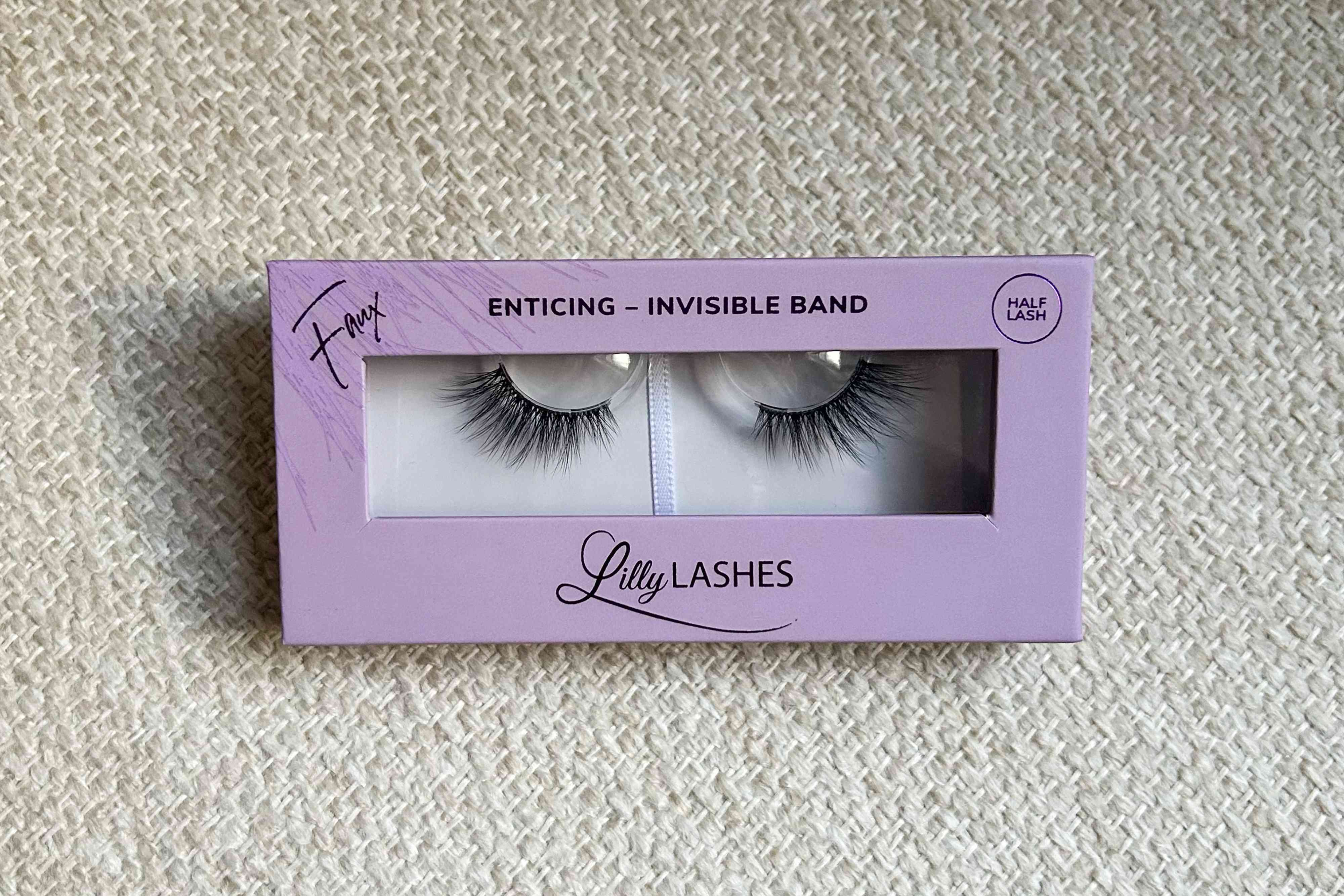Lilly Lashes Enticing Sheer Band Half-Lash on a flat patterned surface
