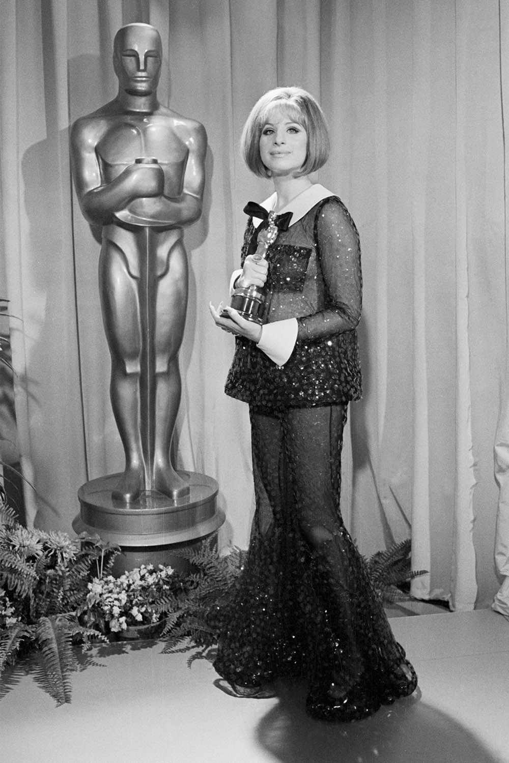 Barbra Streisand with the Oscar she won for Best Actress in Funny Girl.