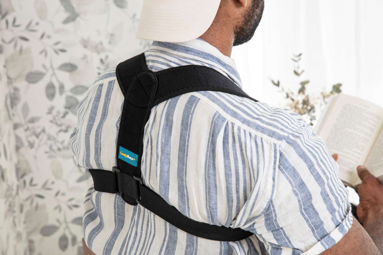 person reading book in Comfy Brace Posture Corrector Back Brace