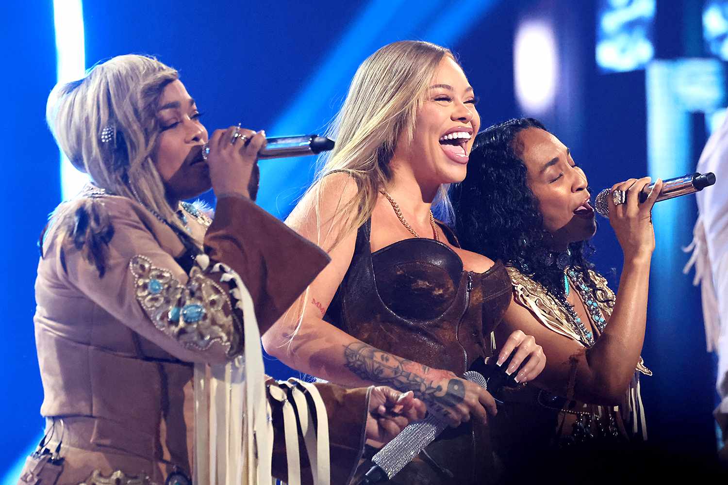 Tionne "T-Boz" Watkins (L) and Rozonda "Chilli" Thomas (R) of TLC perform onstage with Latto (C) during the 2024 iHeartRadio Music Awards at Dolby Theatre on April 01, 2024 in Hollywood, California.