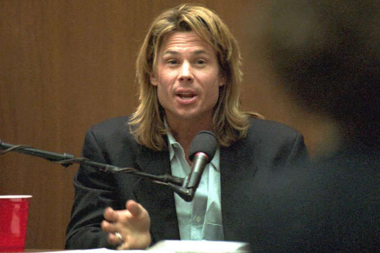 Brian "Kato" Kaelin responds to questions from prosecutor Marcia Clark 27 March, his fourth day on the witness stand in the O.J. Simpson murder trial. 