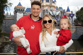 Patrick Mahomes of the Kansas City Chiefs and Brittney Mahomes pose with their children, Sterling, 1, and Bronze, 11 weeks old