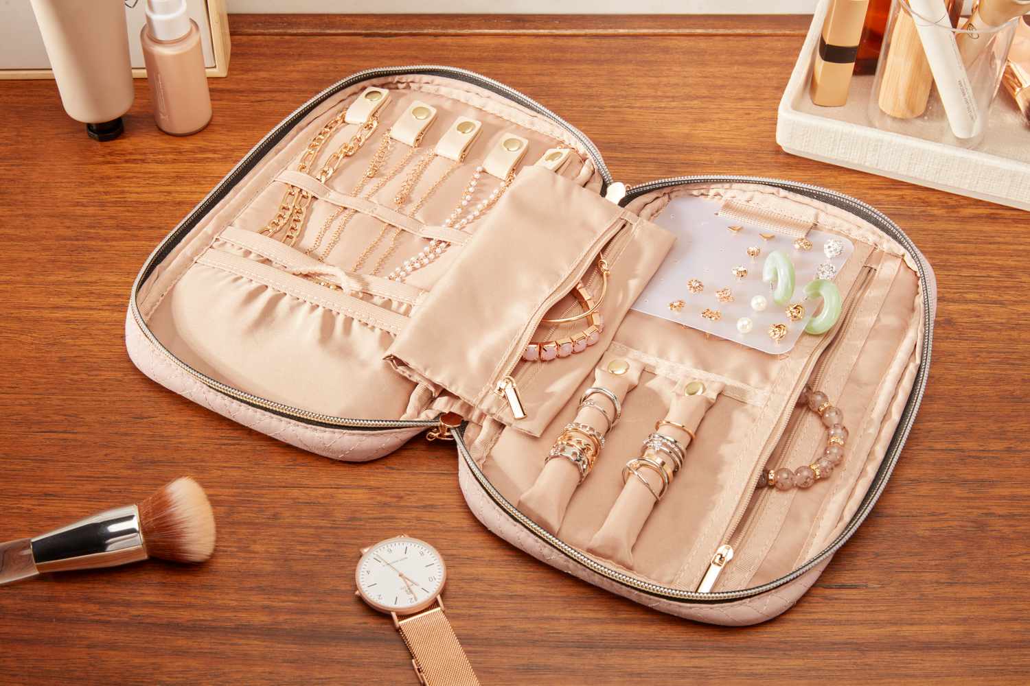 The Bagsmart Jewelry Organizer Bag filled with different types of jewerly.
