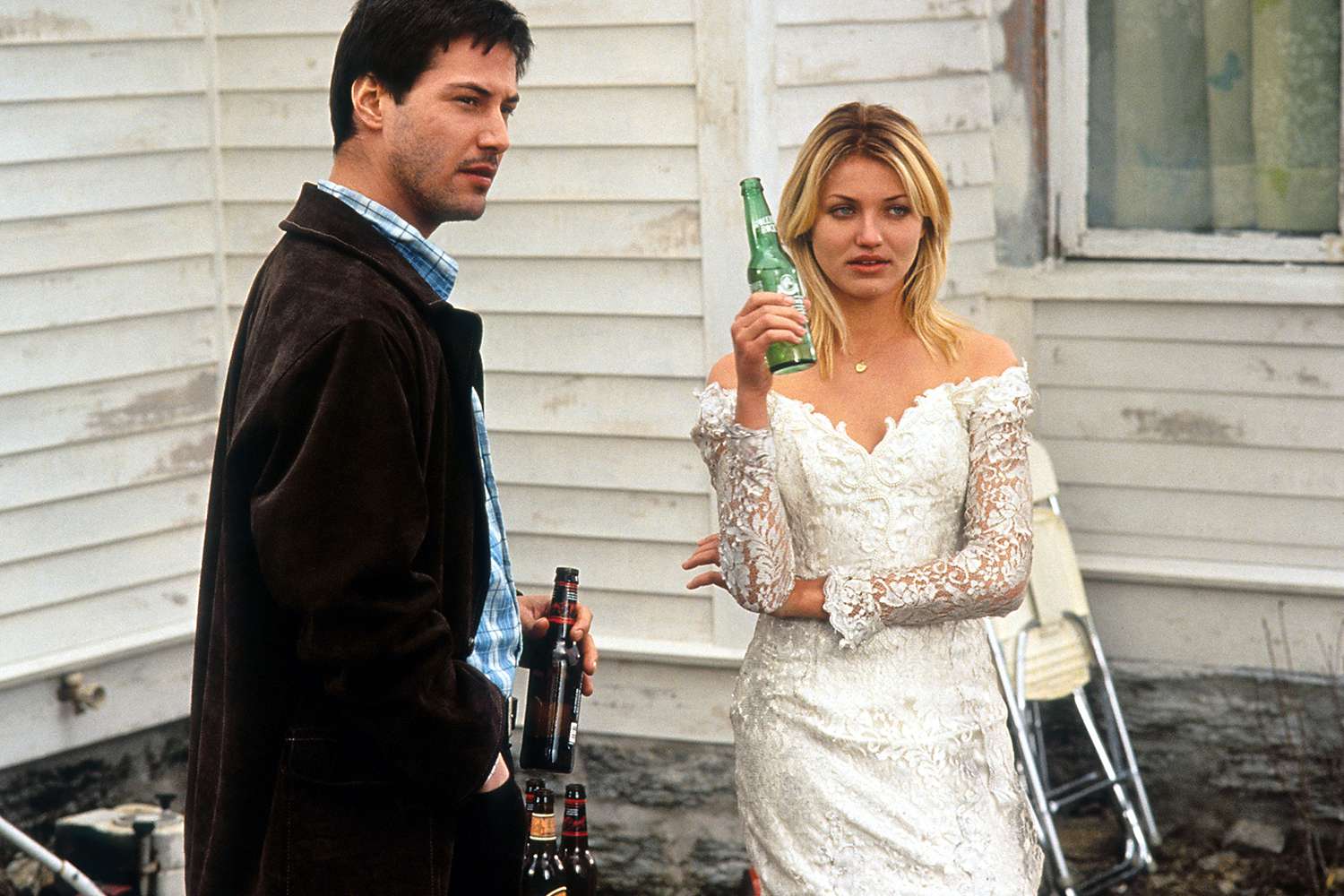 Keanu Reeves and Cameron Diaz having beers in a scene from the film 'Feeling Minnesota', 1996. 