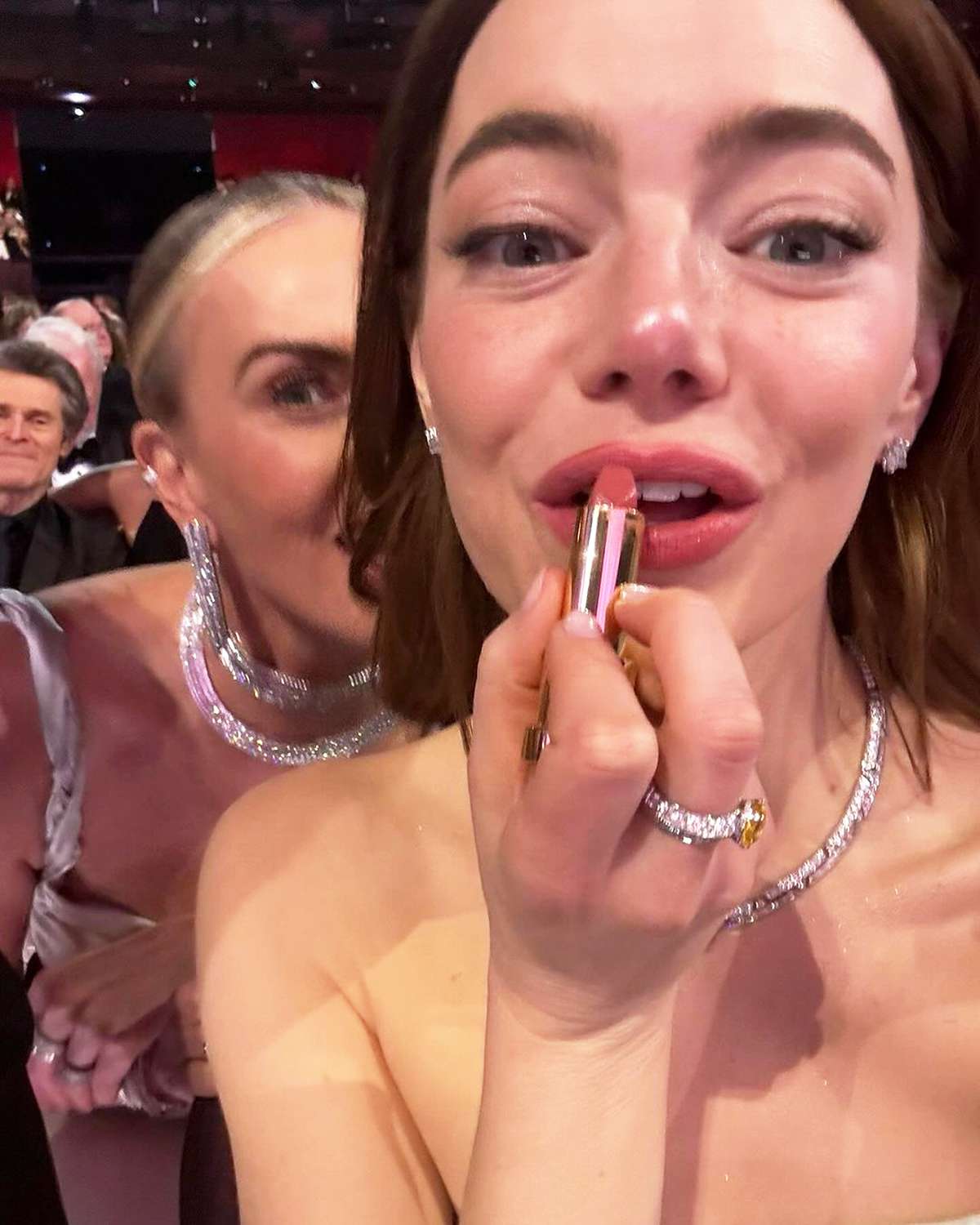 Emma Stone Got the Most Epic Photobomb on Oscars Night While Reapplying Her Lipstick