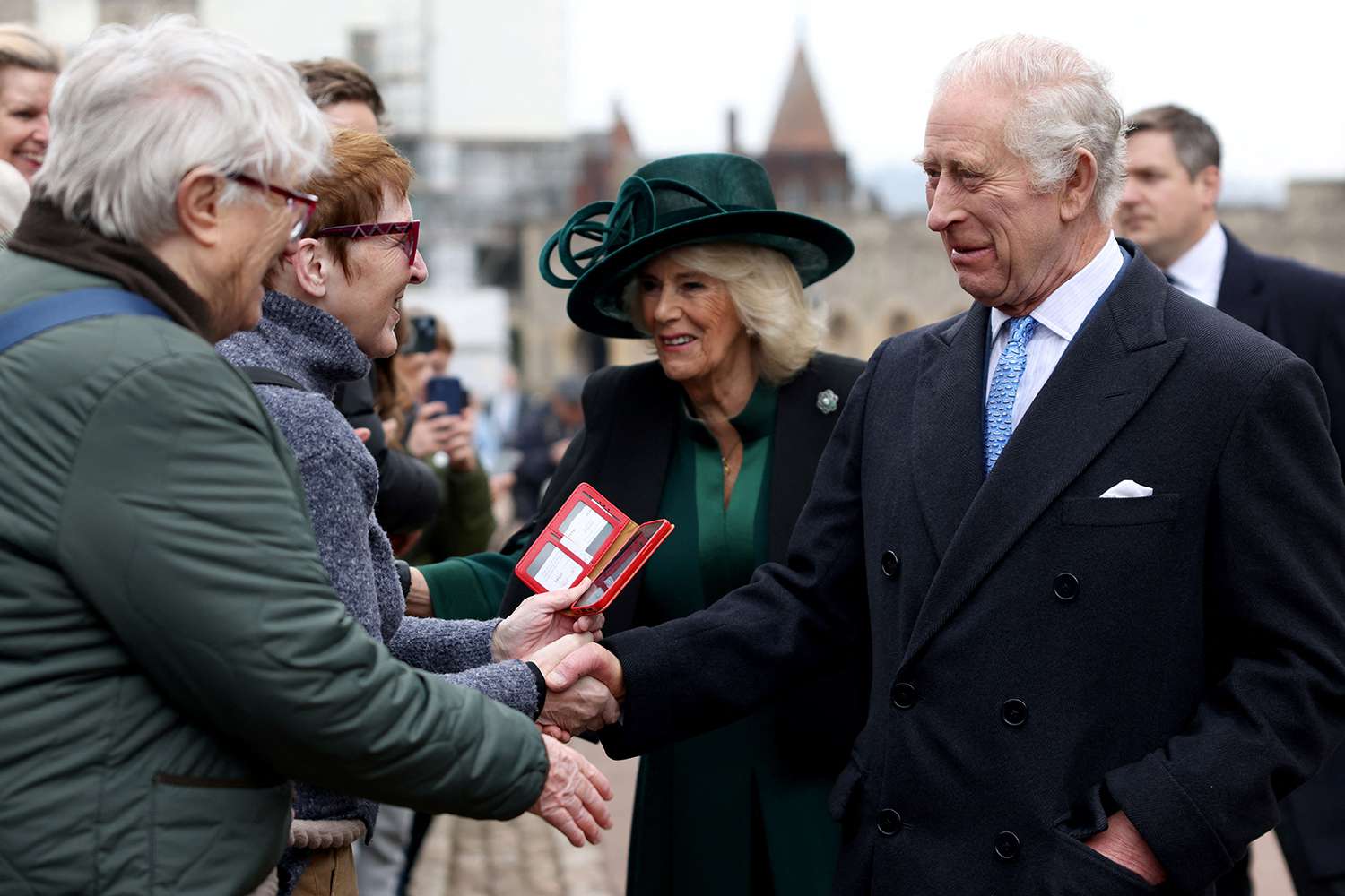 King Charles III and Queen Camilla greet people after attending the Easter Matins Service at St. George's Chapel, Windsor Castle