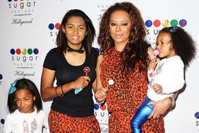 Mel B" Brown and her daughters Angel Iris Murphy Brown, Phoenix Brown and Madison Brown Belafonte attend the grand opening of Sugar Factory Hollywood on November 13, 2013 in Hollywood, California.