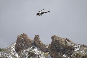 A Utah Department of Public Safety helicopter carries rescuers from Hidden Valley Park, Thursday, May 9, 2024