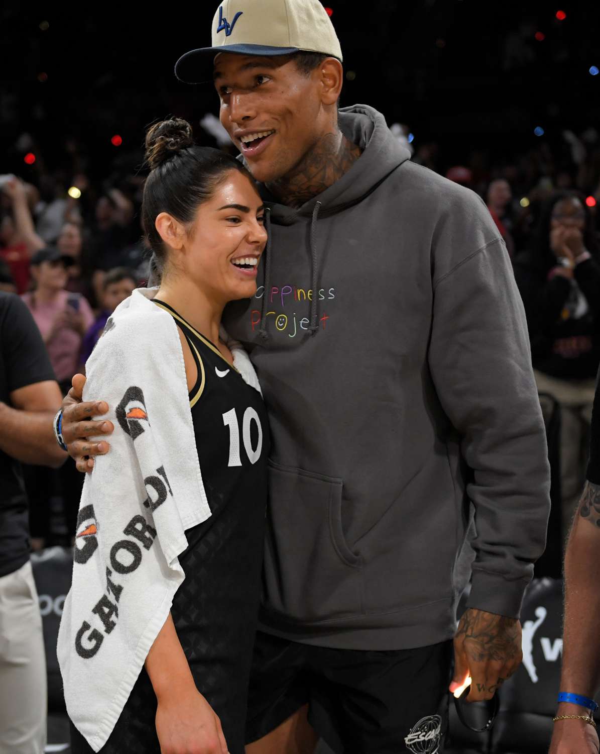 NFL player, Darren Waller embraces Kelsey Plum #10 of the Las Vegas Aces after Round 1 Game 1 of the 2022 WNBA Playoffs on August 17, 2022 at Michelob ULTRA Arena in Las Vegas, Nevada. 