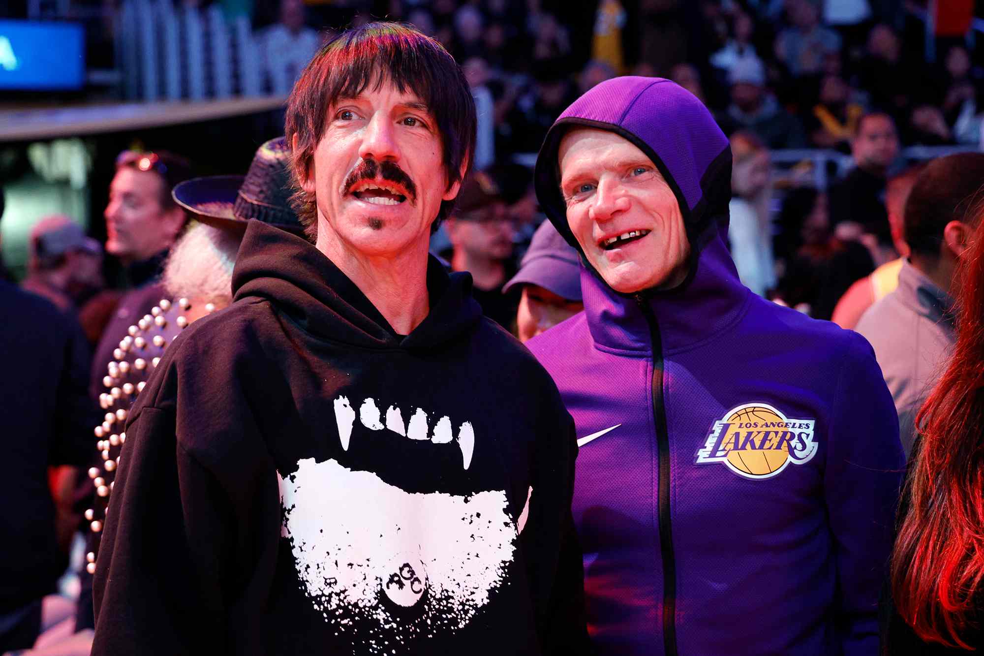 Red Hot Chili Peppers band members Anthony Kiedis (L) and Flea attend the basketball game between the Los Angeles Lakers and the New Orleans Pelicans at Crypto.com Arena 