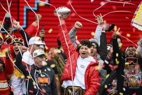 Kansas City Chiefs quarterback Patrick Mahomes and teammates celebrate during the Chiefs' victory celebration and parade in Kansas City